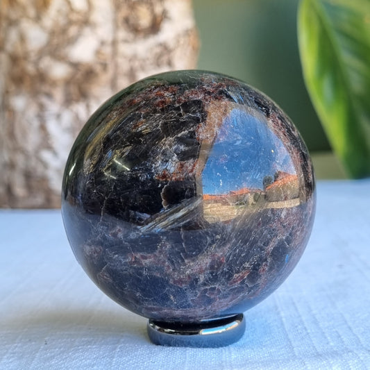 Arfvedsonite & Astrophyllite in Garnet Sphere - 330g