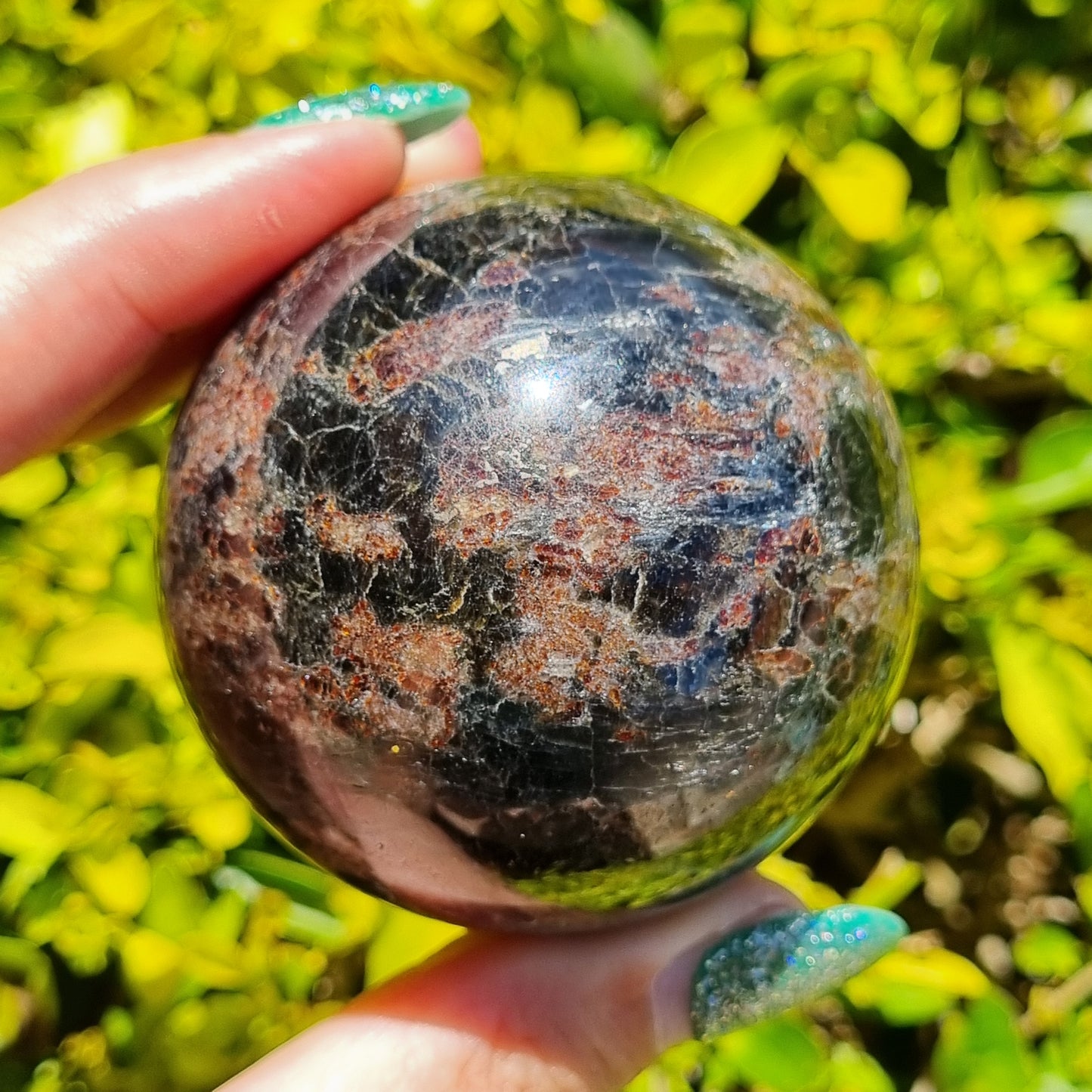 Arfvedsonite & Astrophyllite in Garnet Sphere - 330g