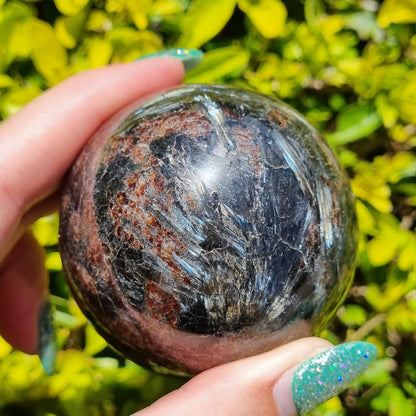 Arfvedsonite & Astrophyllite in Garnet Sphere - 330g